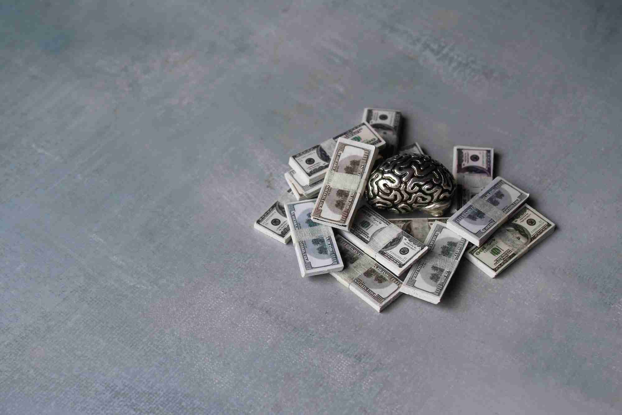 Money and brain with copy space for text